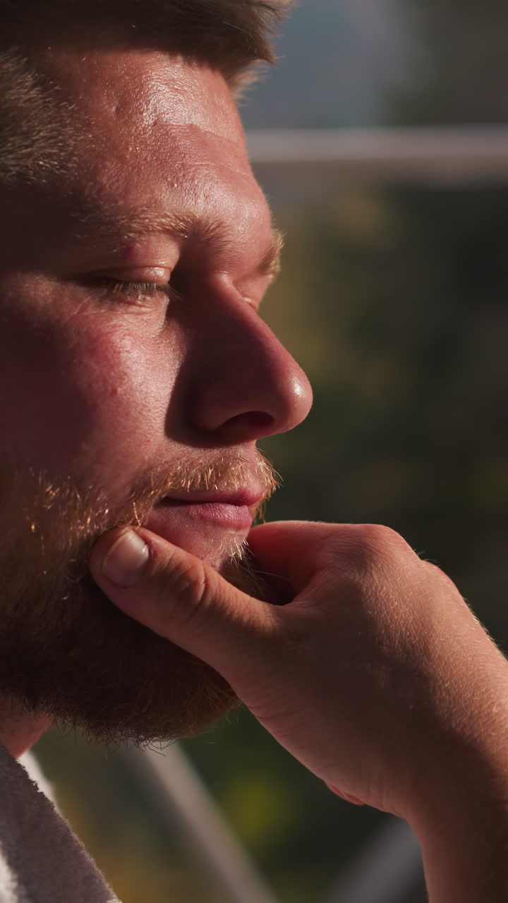 Man with beard thinks about future life closeup. Handsome guy in terry bathrobe touches chin thinking about business project resting at glamping hotel