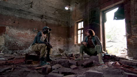 men with guns resting indoors