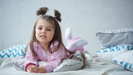 little girl relaxing in pajamas