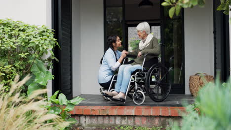 senior woman, caregiver and holding hands