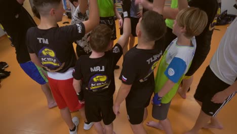 slow motion  video of a young boxer. kid hoping rope. activity children training for boxing game. boxer trainer with children.