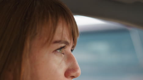 Lady-driver-breathes-hard-from-heat-standing-in-traffic-jam