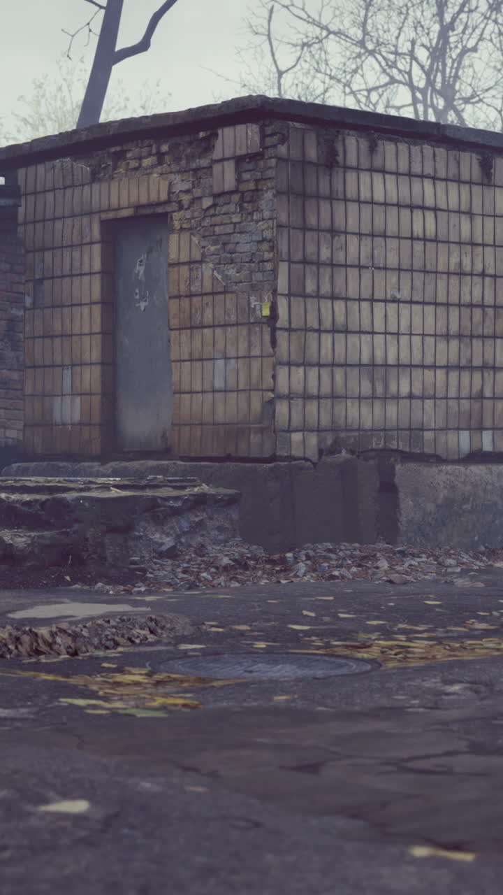 Mysterious abandoned building shrouded in fog during early morning light