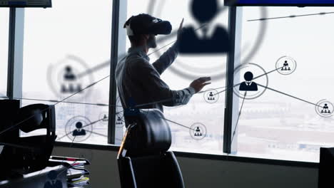 animation of networks of connections and businessman wearing phone vr headset