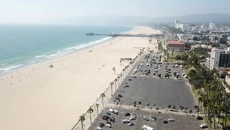 Los-Angeles-beachfront-parking-and-beach-waterfront-property-coastline-aerial-slow-reverse-aerial