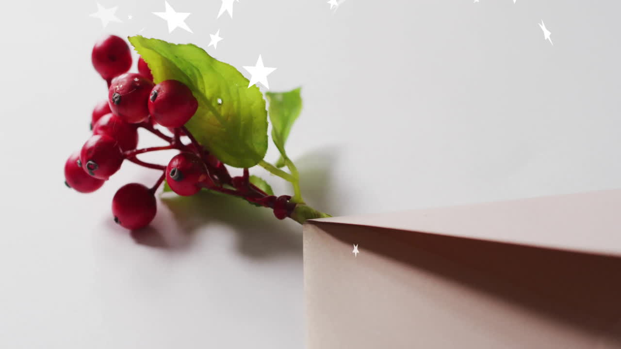 Animation of christmas decorations with copy space over stars on white background