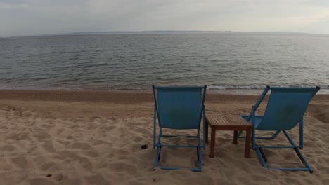 wide back view of a beach blue chairs