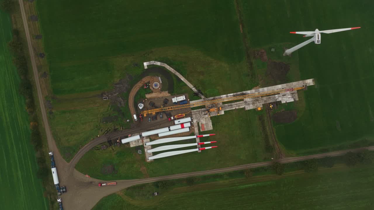 Drone shot of wind turbine base installation at construction site