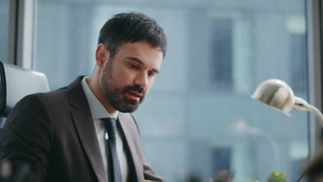 stressed businessman quarrelling zoom conference sitting luxury office close up.