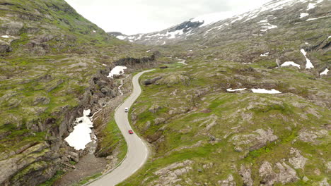 Aerial-View-Of-Vehicles-Driving-At-The-Winding-Road-In-Strynedalen-Valley-In-Stryn,-Vestland-County,-Norway