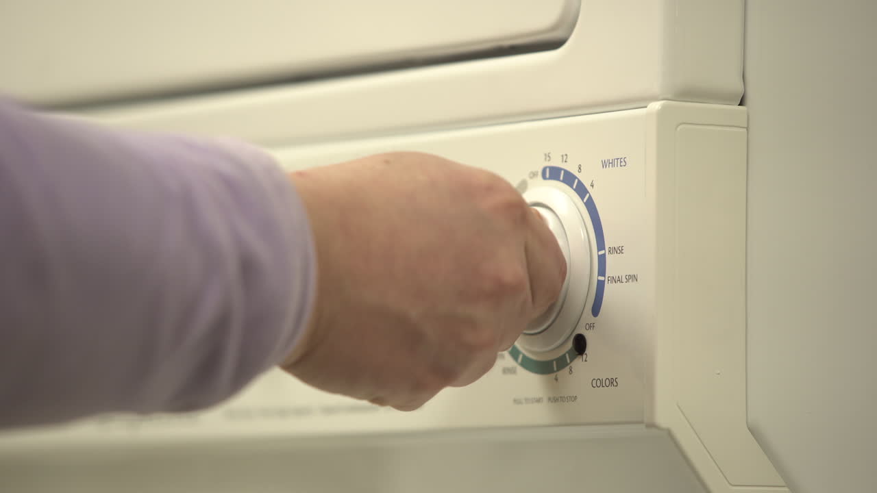 adjusting temperature and settings for laundry