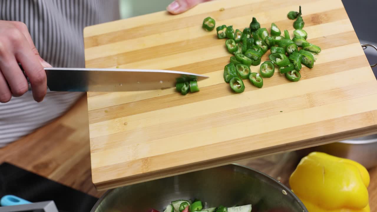 Preparing Green Chilies on a Cutting Board