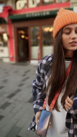 stylish young woman in city street