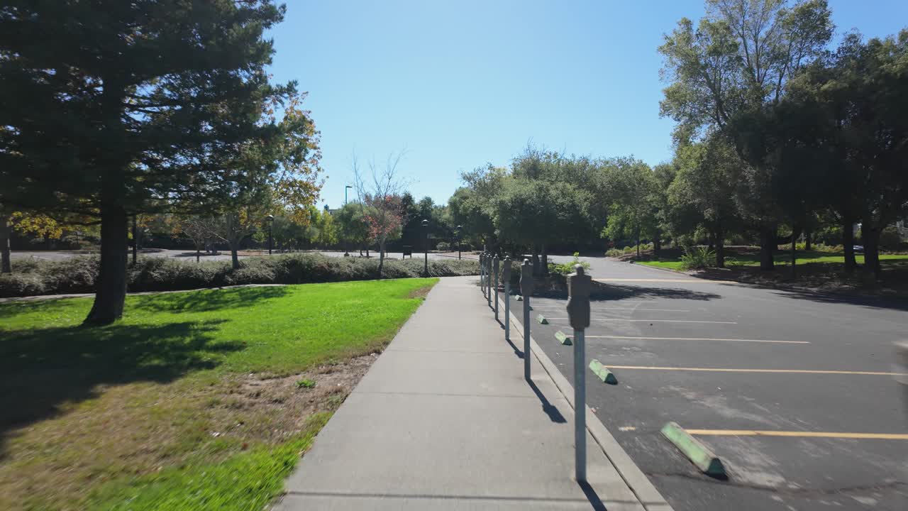 First person view of the lawn and parking lot area of the Petaluma campus at the Santa Rosa Junior College