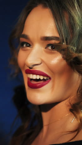 female vocal. woman singing in the recording studio. profile of a woman with a beautiful face and lips. vertical video
