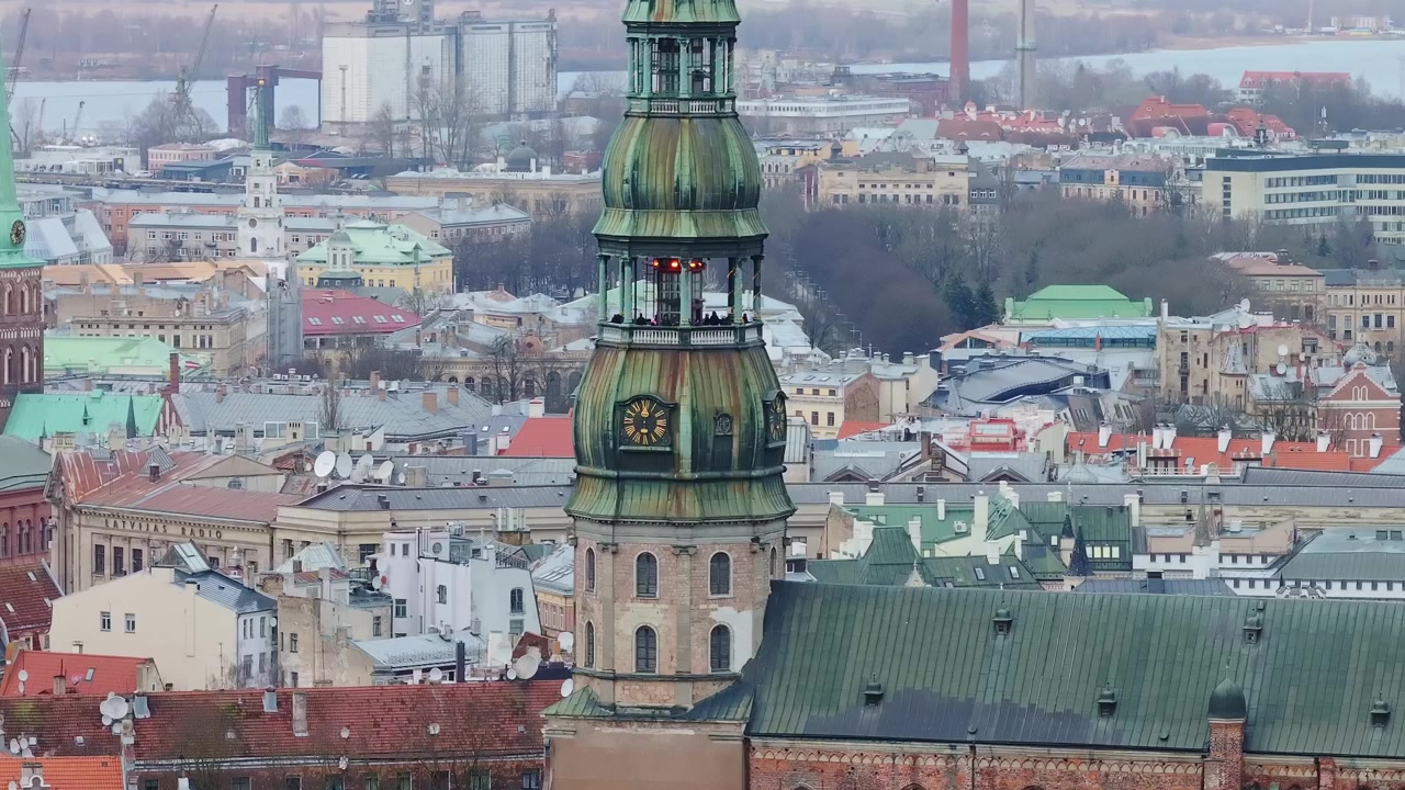 Slow-motion drone of St. Peter's Church in Riga, medium tele lens detail, Latvia