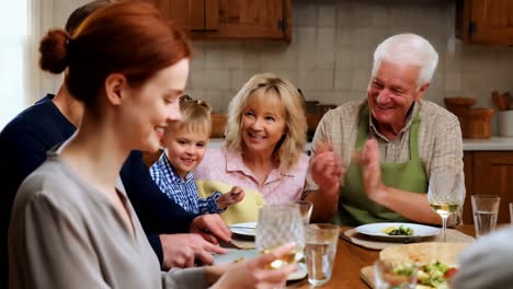 Multigenerational family sharing a meal at home.