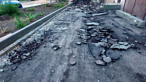 a sidewalk in crimea, russia, with a large portion of the pavement removed