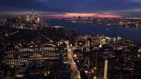 sunset view of downtown new york at manhattan in new york united states. sunset city landscape. illuminated downtown. downtown new york at new york united states. one trade center building.