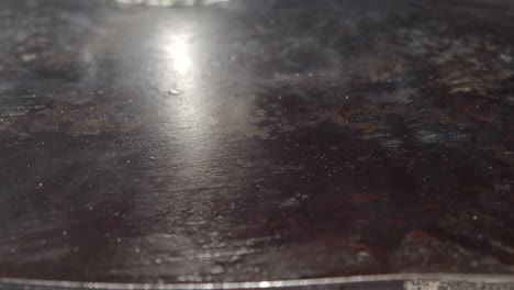 close up of smoke rising from a hot griddle