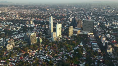 beautiful establishing aerial view of mexico city buildings at dusk