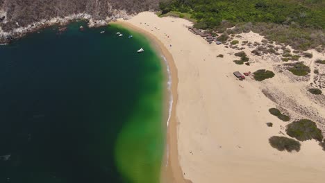 aerial drone shots of cacaluta bay in huatulco, oaxaca