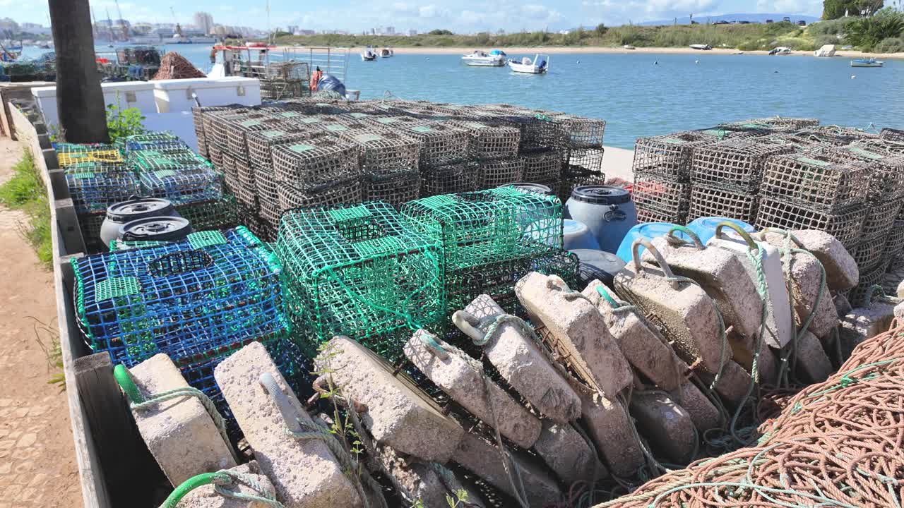 Colorful crab traps with weights laying on the pier, ready for fishing in Ferragudo, Portugal