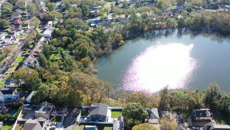 an aerial view of grant pond in a long island, ny suburb