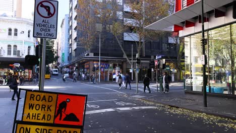 pedestrians and vehicles at a city intersection