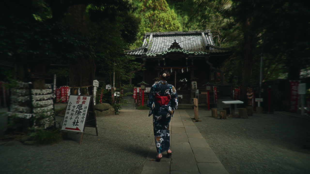 Woman in Kimono Visiting a Japanese Shrine