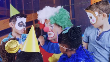 Animation-of-snow-falling-over-diverse-children-and-clown-at-birthday-party