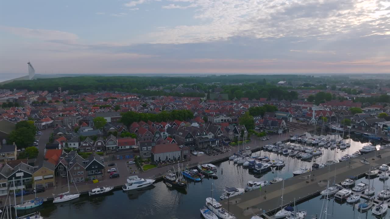 Historic Urk fishing village and marina with yachts in the Netherlands, aerial shot