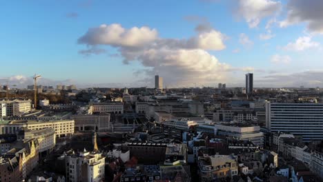 aerial downward flying at grand place on sunny and cloudy day of january over brussels city in belgium