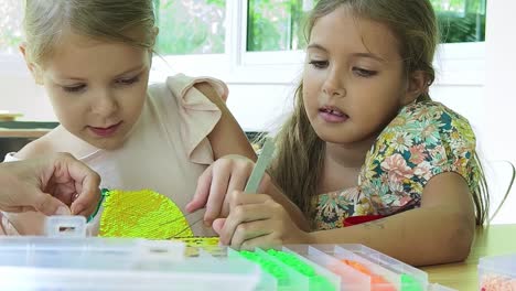 two young girls crafting together