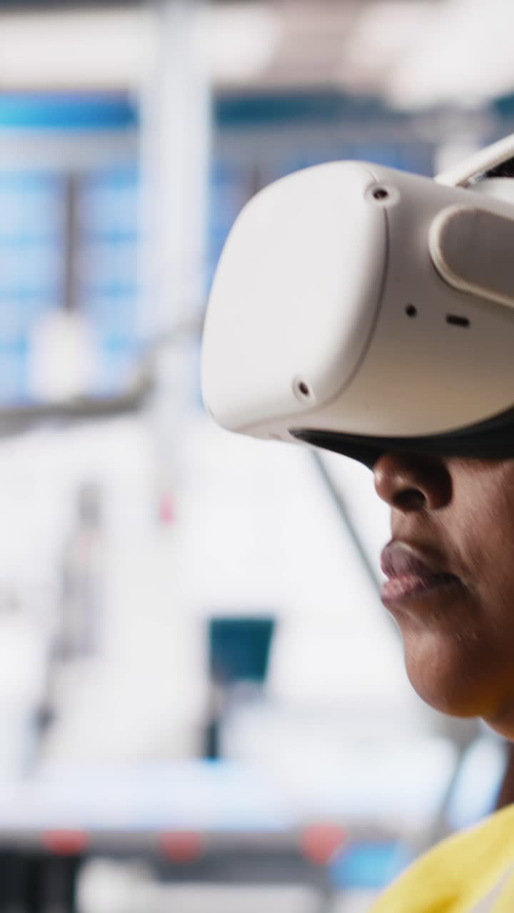 Vertical Video Black engineer in photovoltaics factory uses virtual reality equipment