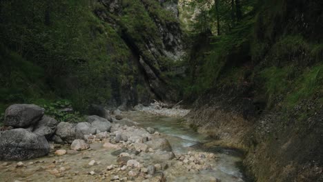 Serenity-of-nature-as-water-flows-between-large-white-pale-rocks-in-the-gorge-of-Almbachklamm,-static