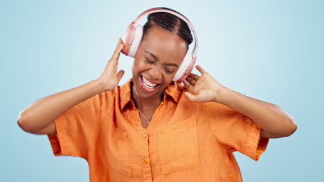 Dance,-happy-woman-and-music-headphones-in-studio
