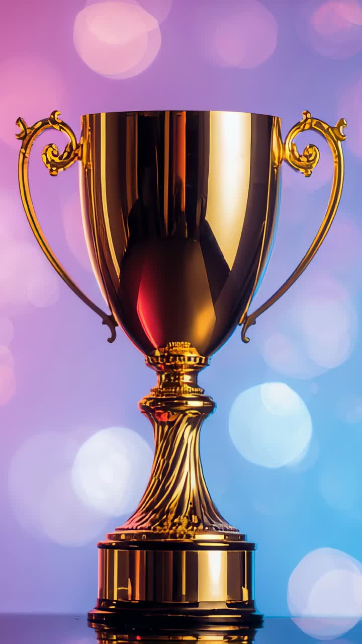 Vertical video: Shifting lights making gold trophy reflecting on studio table, showing bokeh detail