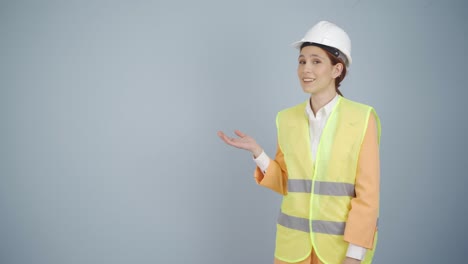 engineer looking at camera in amazement and making a presentation.