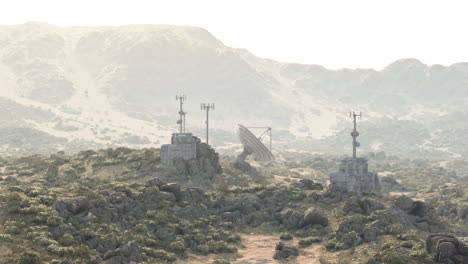 military communication towers at a remote mountain base in clear weather