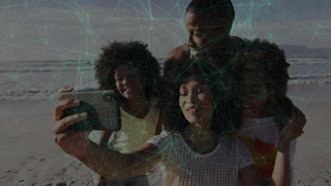 family taking selfie on beach with network connections animation overlay