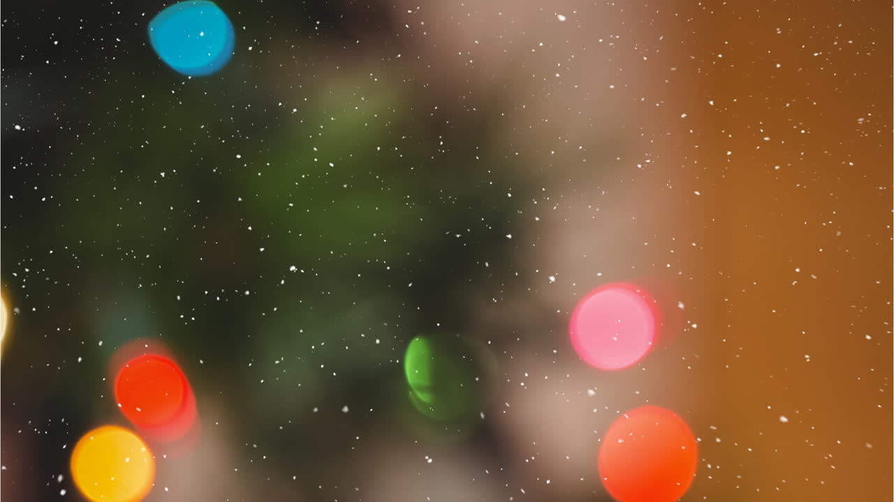 Animation of snow falling over christmas decorations