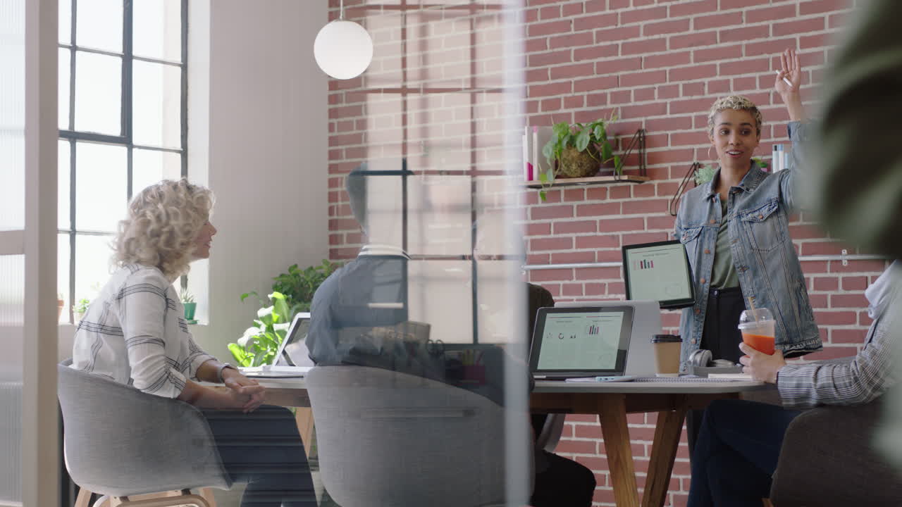 young african american business woman using digital tablet computer presenting financial graph data showing colleagues vote in office presentation diverse team collaborating brainstorming strategy