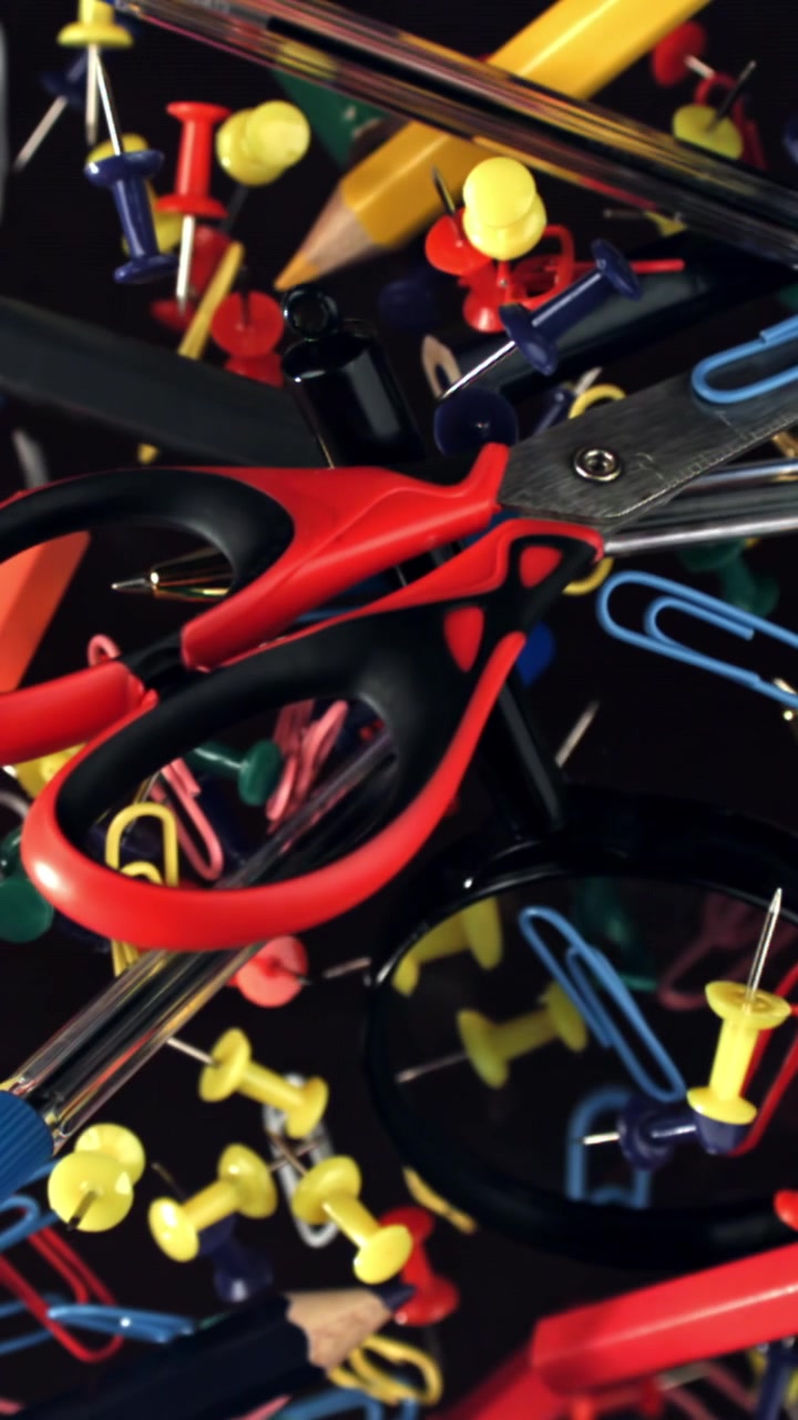 Colorful Office Supplies Floating and Coming into Focus