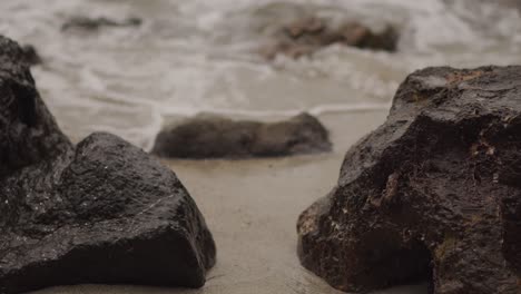 beach rocks with water running through them