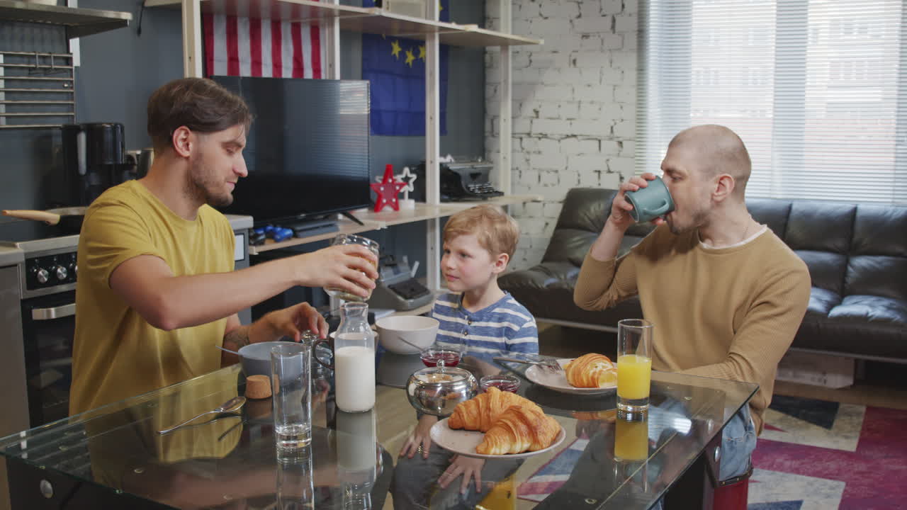 Gay Couple with Son Enjoying Breakfast