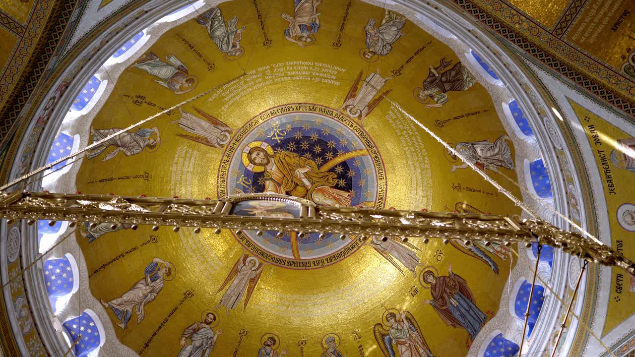 View of the chapel ceiling at San Sava Temple in Belgrade, Serbia, highlighting intricate frescoes, ornate decorations, and vibrant Orthodox religious art