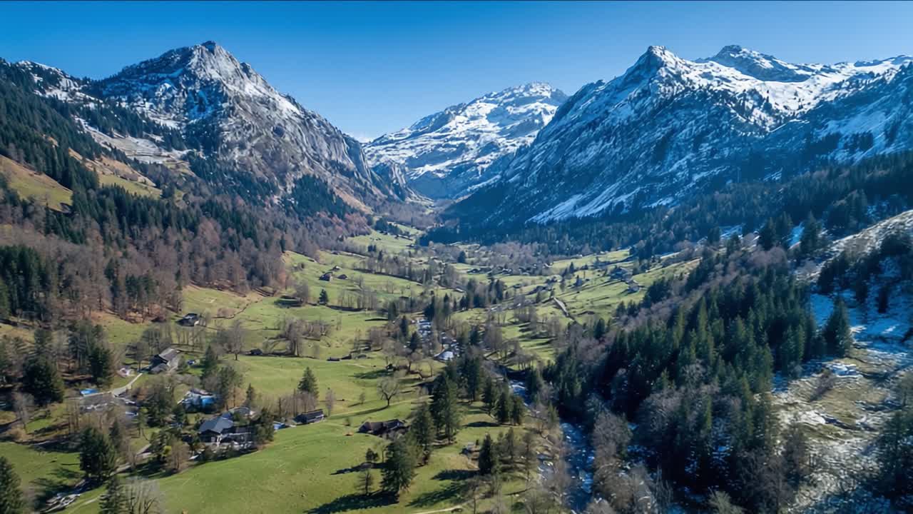 Aerial View of Serene Mountain Landscape with Snow-Capped Peaks and Lush Green Valleys, Highlighting the Beauty of Nature's Harmony in a Picturesque Setting