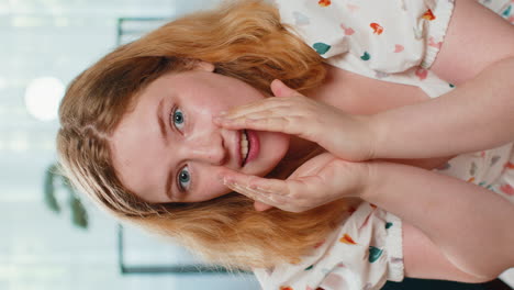 red hair woman whisper news rumors holding hands near mouth share gossip quiet keep my secrets