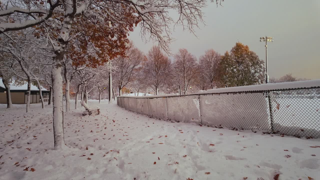 Snow-covered Lafond Park With Fence During Winter In Montreal, Canada. - wide shot